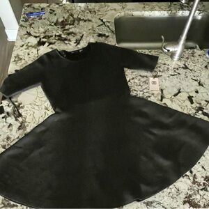 Ivanka Trump black/grayish dress.